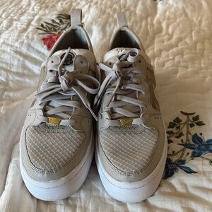 Nike Beige Sneakers with Gold Accents